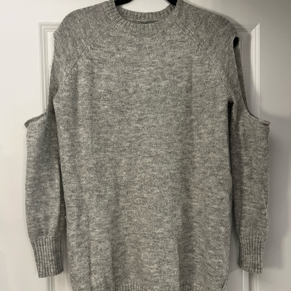 Sweater with shoulders exposed